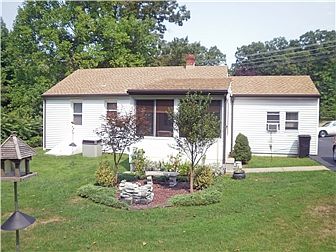 Rear screened porch overlooking a private yard