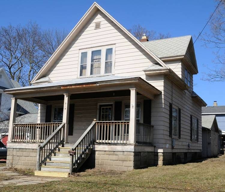 BUILT WITH QUALITY OF yesteryear. The full covered front porch greets you, even has new steps. Spacious home with 26 ft living room, separate dining room and 3 generous bedrooms upstairs, 2 full bath with new updates, 2 new pedestal sinks and 2 new commodes. This is a lovely fresh, clean, well maintained  home. New water heater and newer electric, newer furnace, new laminate kitchen floors. Full basement and an 18x18 detached garage.  Convenient location to the downtown festivities and close to farmers market, Tridge, and rail trail.  Definitely worth a showing.