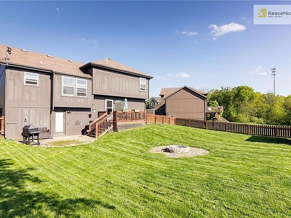 Large backyard with firepit, deck and walk out subbasement that could be a fourth conforming bedroom.