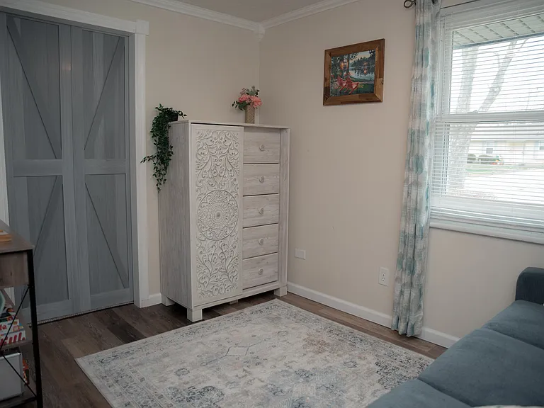 A versatile flex space featuring a comfortable sofa that easily converts into a bed for extra guests.