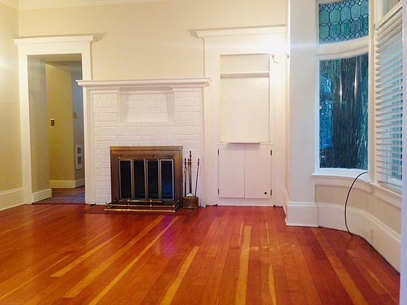Solid wood floors, curved bay window and glass