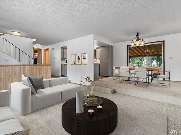 Open concept living and dining area. Slider leads you out to covered patio/ backyard. 