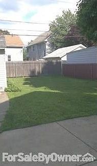 Part of back yard
						:
						Patio is on back of house; yard also extends along the south side of the home