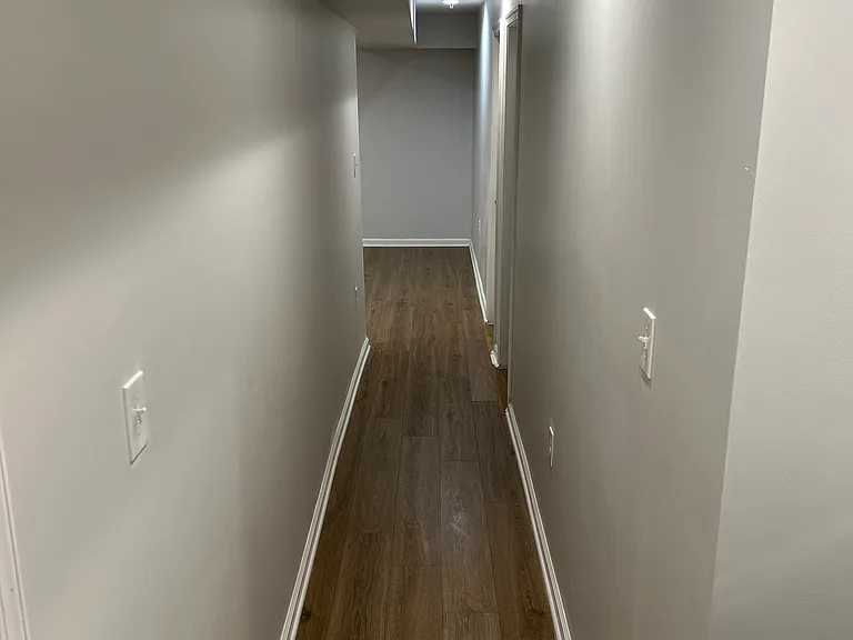 Hallway leading to both rooms