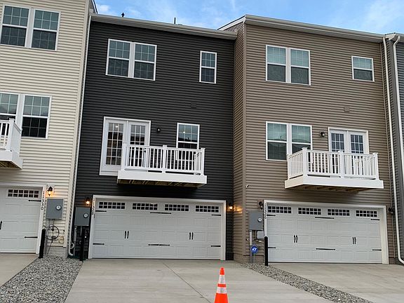 Two Car Garage Entry with Deck off the Kitchen