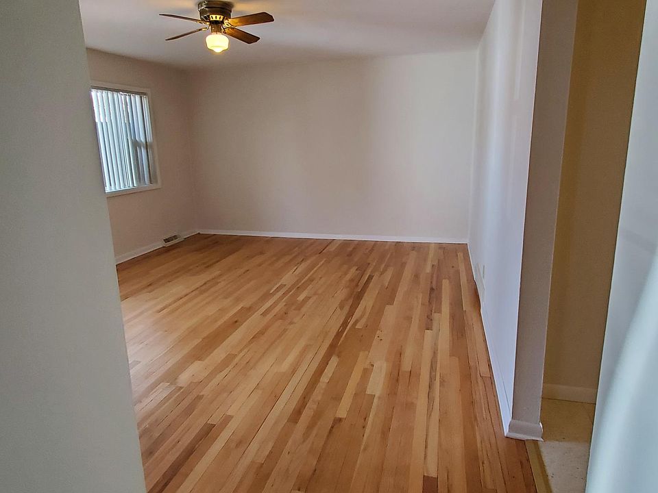 Looking into the living room from the hallway. Kitchen is on the right.