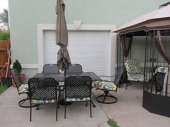 Patio in the back, older photo as the house has recently been painted