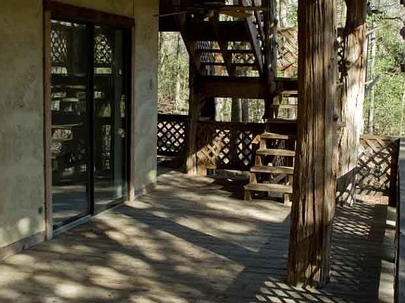 porch with one bedroom's patio door