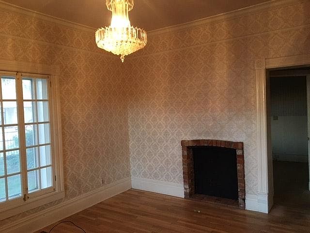 Beautiful room with historical chandeleir and fireplace