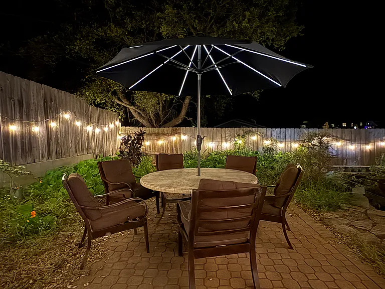 Outdoor dining with solar umbrella for freshing al fresco dining.
