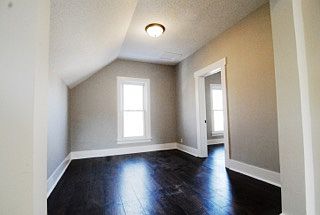 Airy living room. Unit has its own furnace and water heater.