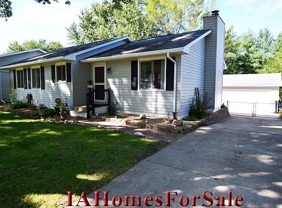 Front Entry with driveway to garage.