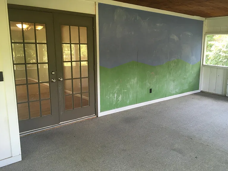 Chalkboard wall for the kids in the screened in porch