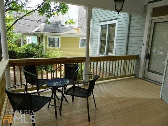 Covered front porch with plenty of space to lounge