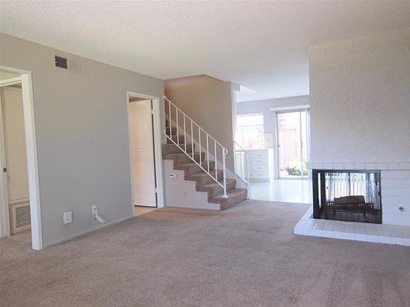 Light, airy, freshly custom painted...off the living room is a tiled hallway with AC controls, coat closet, and 3rd bath with shower!