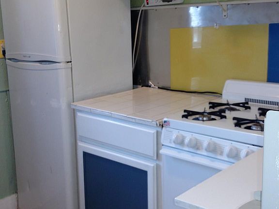 Stove, frig, mic, pot rack, mobile Island. 