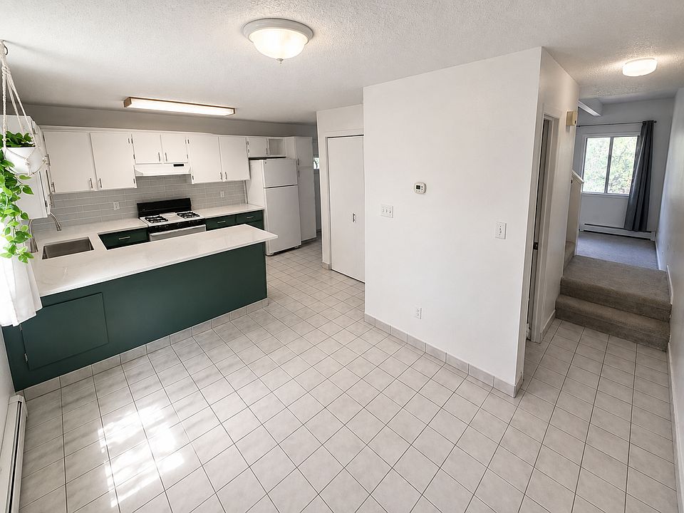 Kitchen, Dining, and Hallway to Living and Half Bath