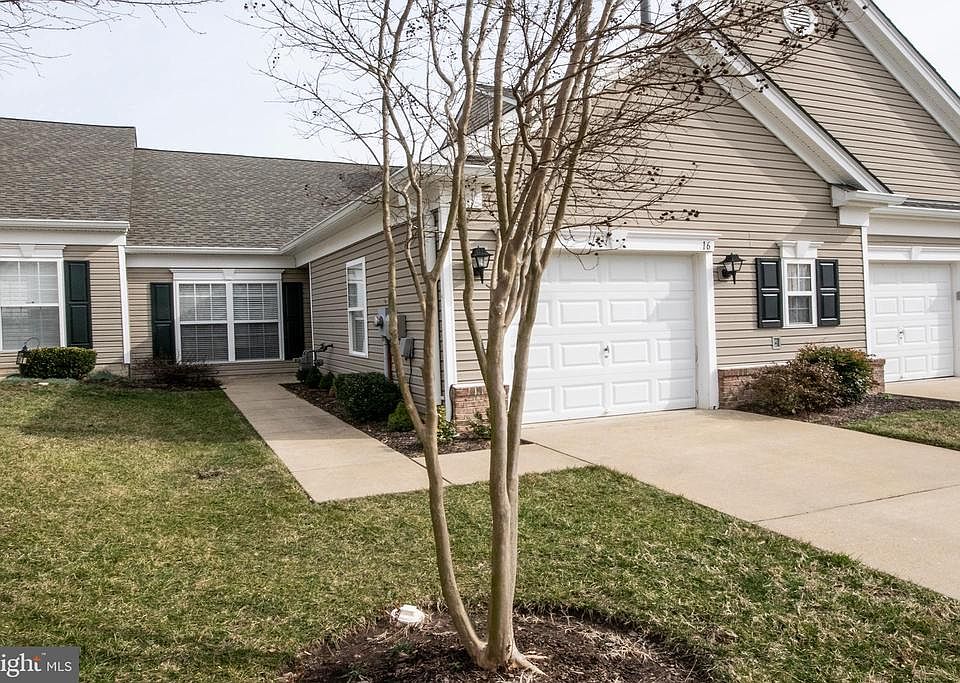 Front with sidewalks and front entry.