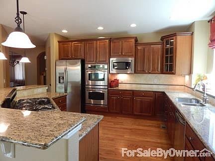 Gourmet kitchen with GE Profile appliances.