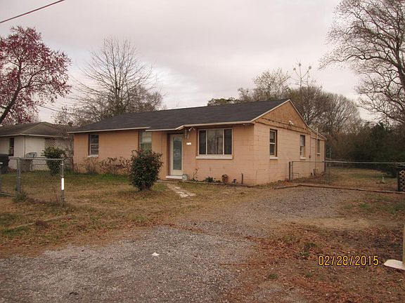 Front with rose bushes and camillas
