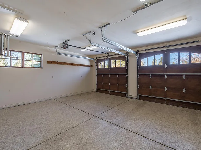 Two car garage with epoxy flooring and two automatic garage door openers