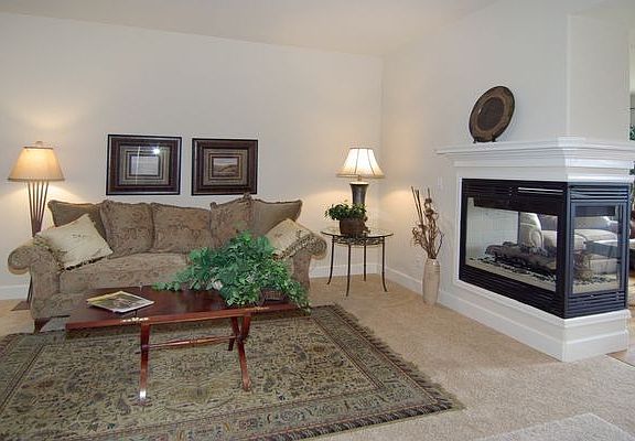 Formal living room with 3 sided fireplace