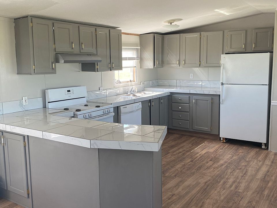 Newly painted kitchen cabinets and new countertops