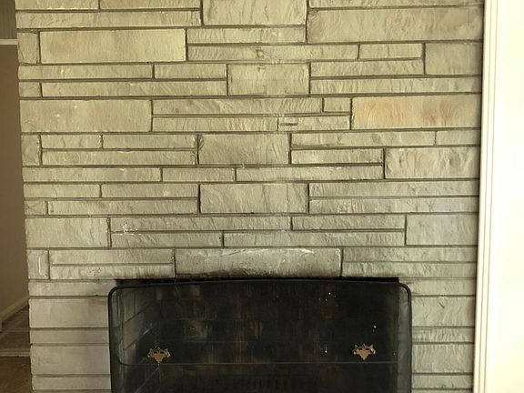 Midcentury stone living room fireplace