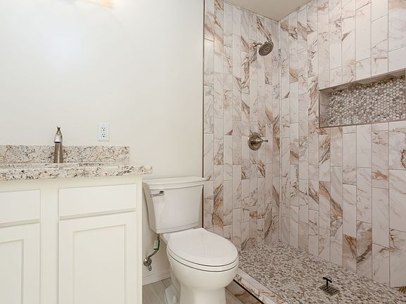 Master Bathroom with Tiled Walk-in Shower.