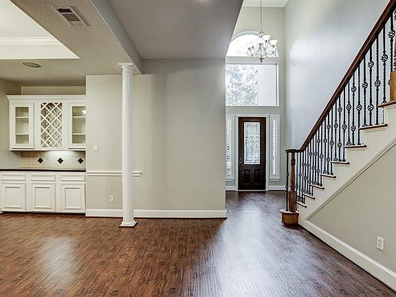 Beautiful and elegant. Large entry, soaring ceilings lots of light. View of entry from formal dining room.