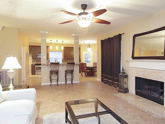 LIVING ROOM - Over-sized Ceramic Tile flooring, very open, easy access to the kitchen and neutral colors is what you'll find here. This room is where families come together!