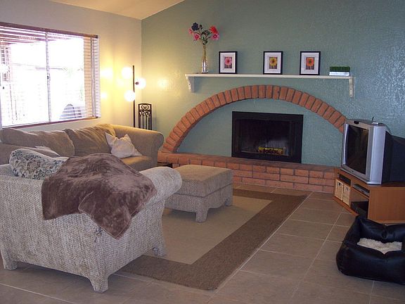 Family room with wood-burning fireplace and vaulted ceilings