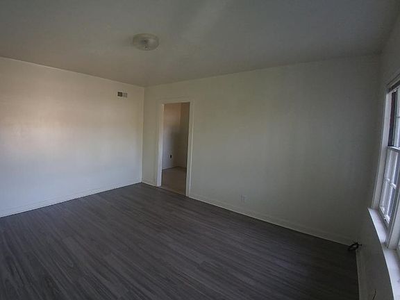Living room has random plank flooring.