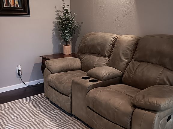 Relax on this reclining electric comfortable couch reading or watching your favorite movie or TV show.