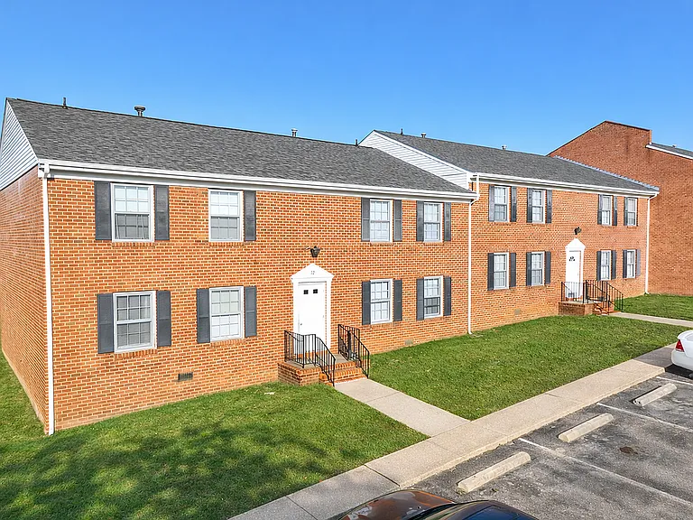 Two-story red brick apartment buildings