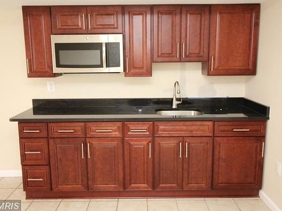 Kitchen with refrigerator