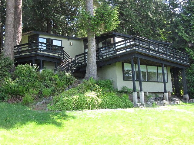 Back of home. Note new deck beams. Views are spectacular from all of the windows and deck.