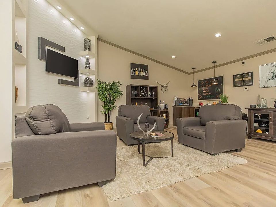 Experience the elegance of The Riley, where modern design meets cozy living. Our inviting common area features stylish furnishings and a warm ambiance, perfect for relaxation and social gatherings. Explore your new home today!