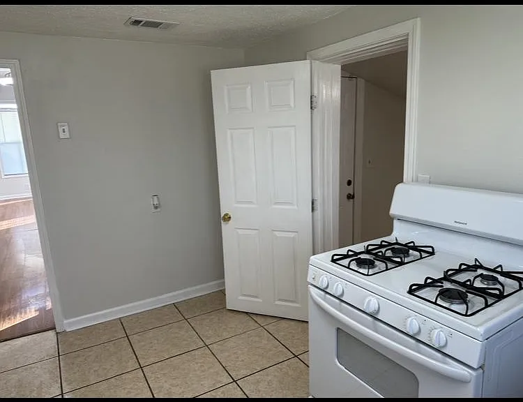 Kitchen, with door to laundry room