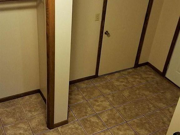 Entry Way/ Landing with Coat Closet and Access to Garage