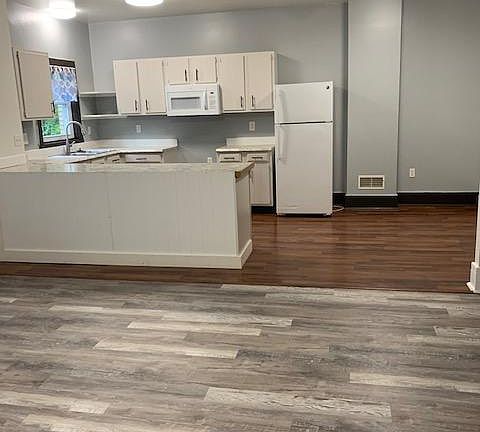 1st floor living/ dining area, new plank flooring
