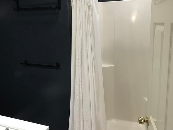 Showerhead, trim kit, fixtures, bath sink cabinet, lighting all 2 years old.
