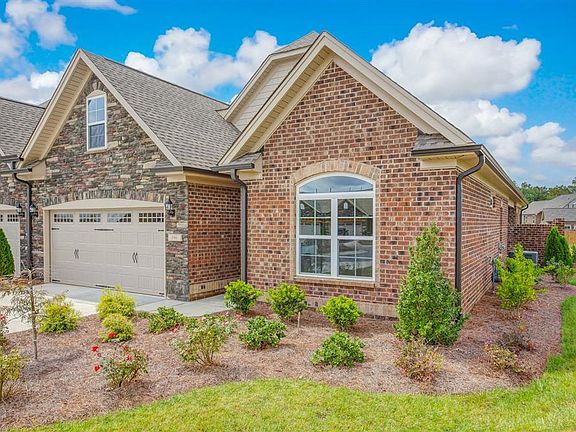 End unit town home with professional landscaping