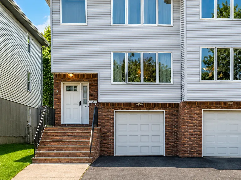 Left-side duplex home with private entrance and driveway parking