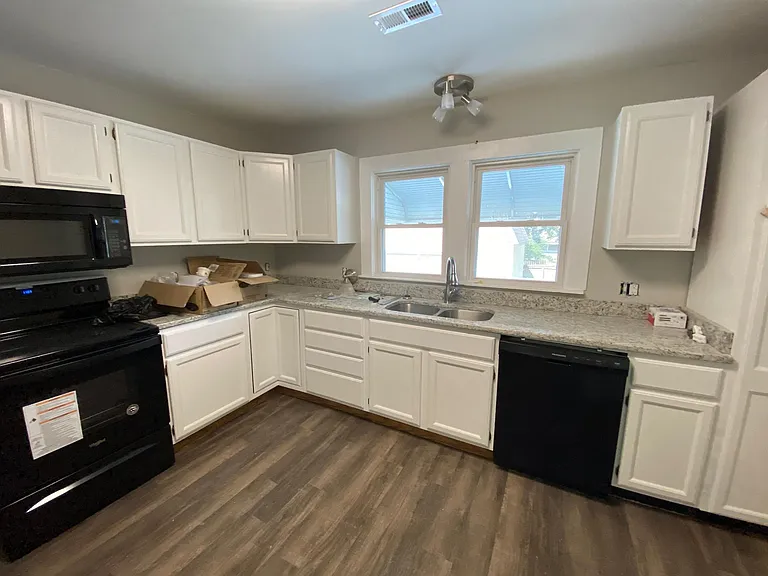 Granite, new appliances, dishwasher, dispose-all, microwave, easy care floor, side by side stainless fridge, spacious cabinets, lazy Susan storage, new fixtures, stainless sink, tons of storage/cabinet space.