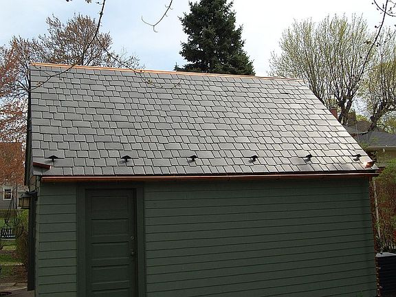 Detached garage with new, faux slate (recycled rubber) roof with copper