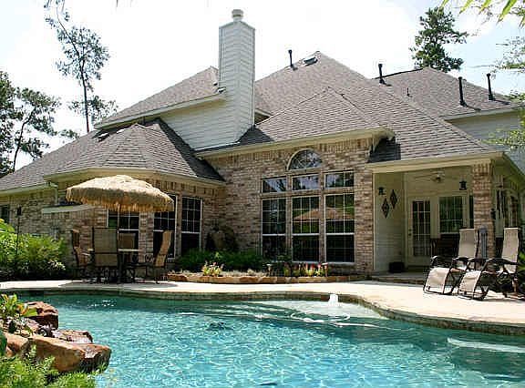 Back of Home with custom pool and amazing waterfalls.
