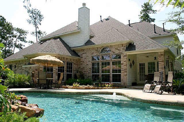 Back of Home with custom pool and amazing waterfalls.