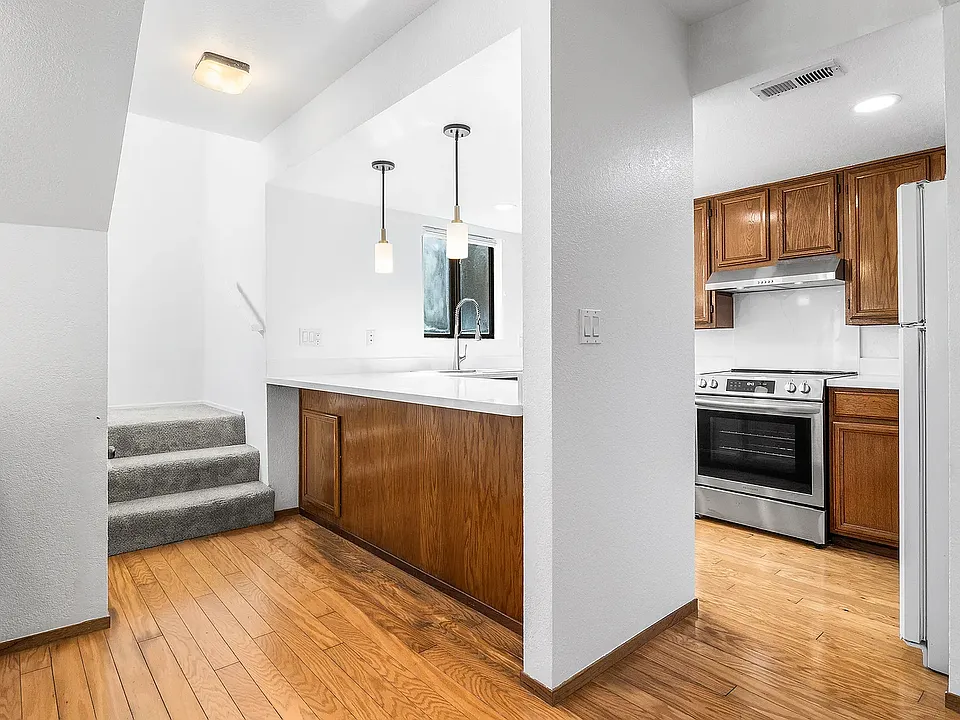 Kitchen and stairway to master bedrooms upstairs