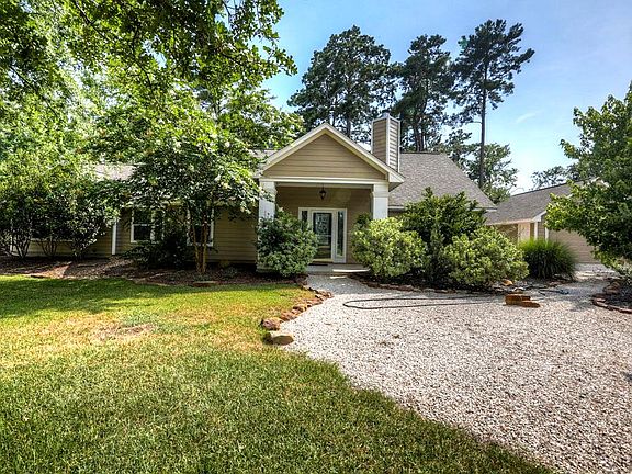 Long circle drive leads up to home with hardi exterior. Leaded glass front door with side lights and